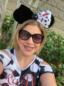 lauren hersey wearing Cruella devil outfit with matching disney ears and sunglasses 