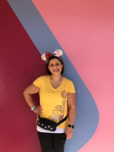 Lauren hersey at Epcot wearing a figmet outfit, epcot ears and a fanny pack